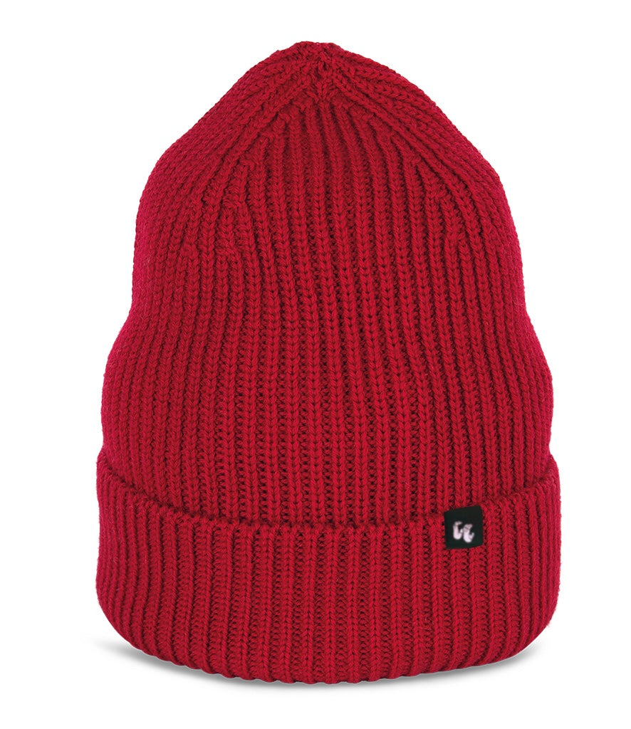 A bright red beanie with chunky, fisherman-style ribbed knit. It has a black fabric label with a white logo stitched to the cuff