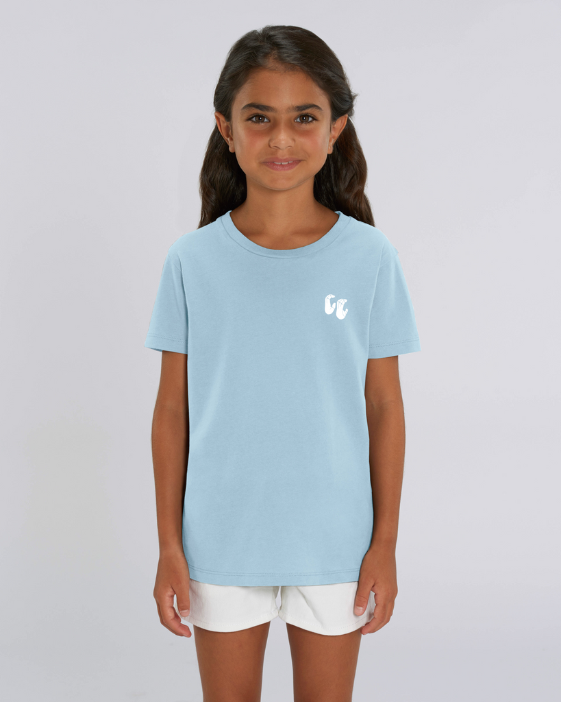 A girl wearing a kids organic cotton t-shirt in sky blue, with a printed white left chest logo