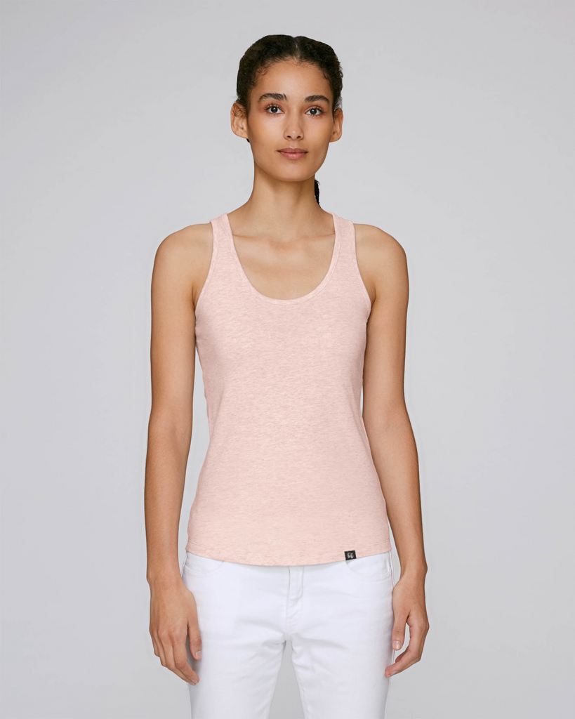 The front view of a woman wearing an organic cotton racer back tank top in heather pink