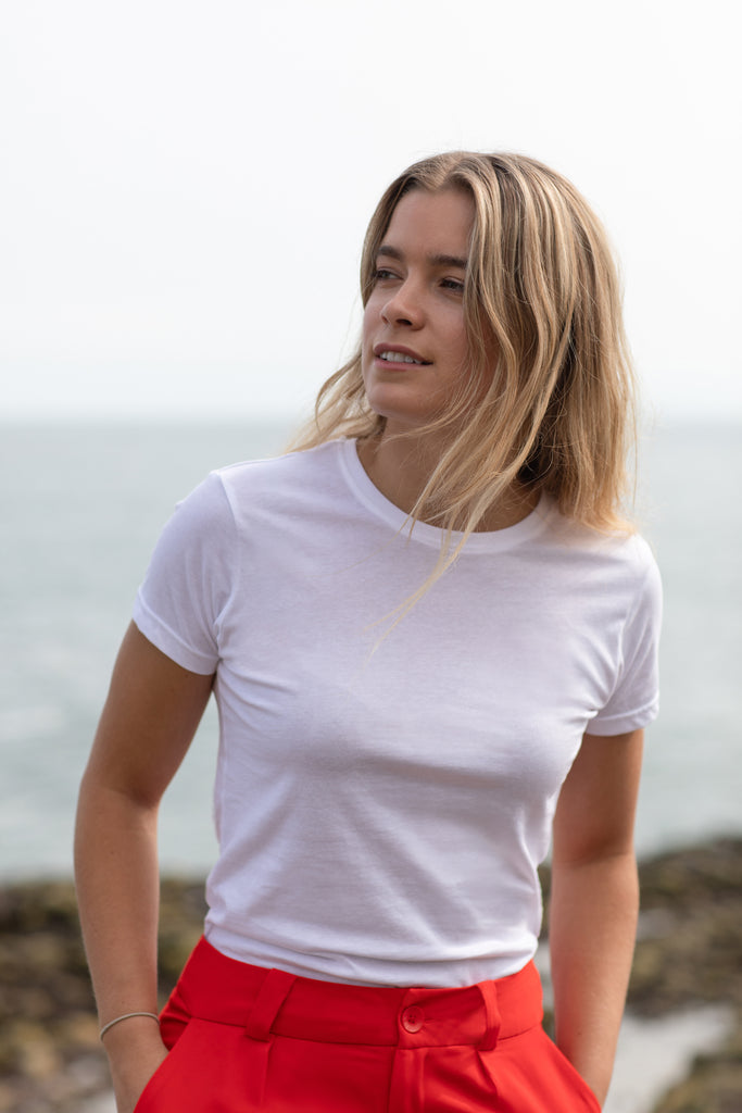 Women's 100% organic cotton t-shirt in white at the ocean