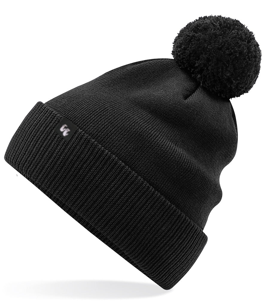 A black bobble hat beanie with pom pom made from organic cotton