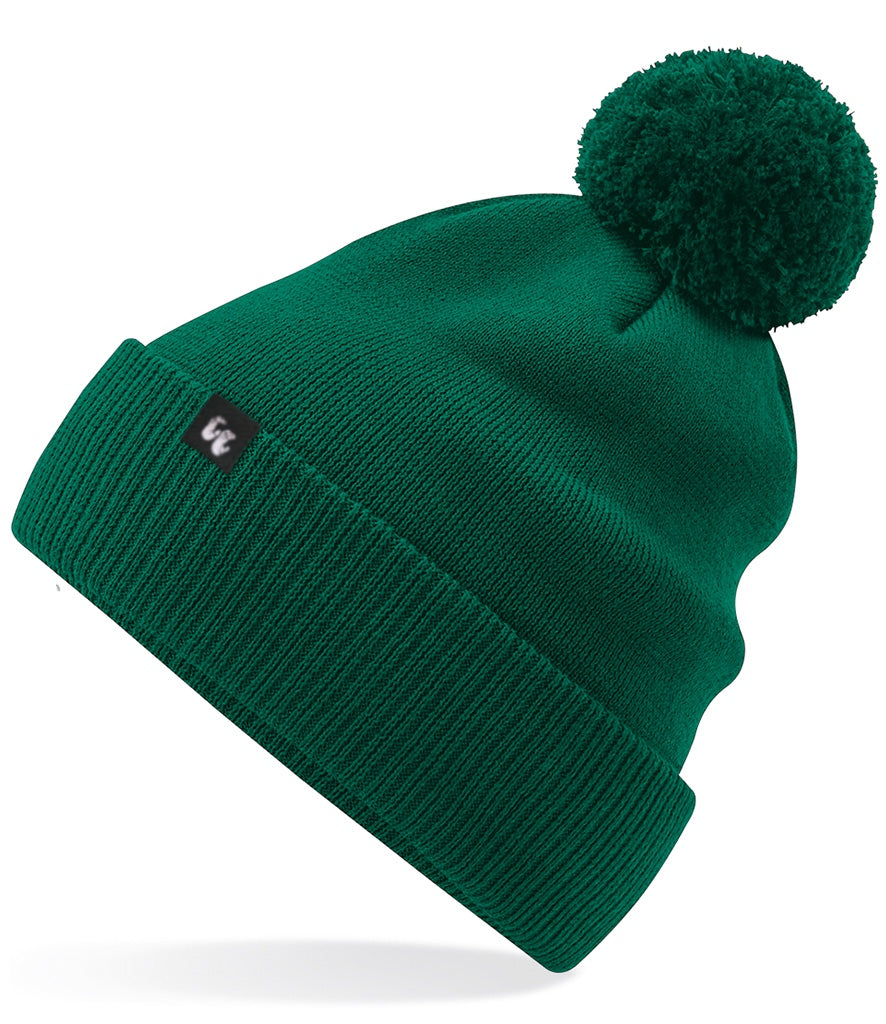 A bottle green hat beanie with pom pom made from organic cotton