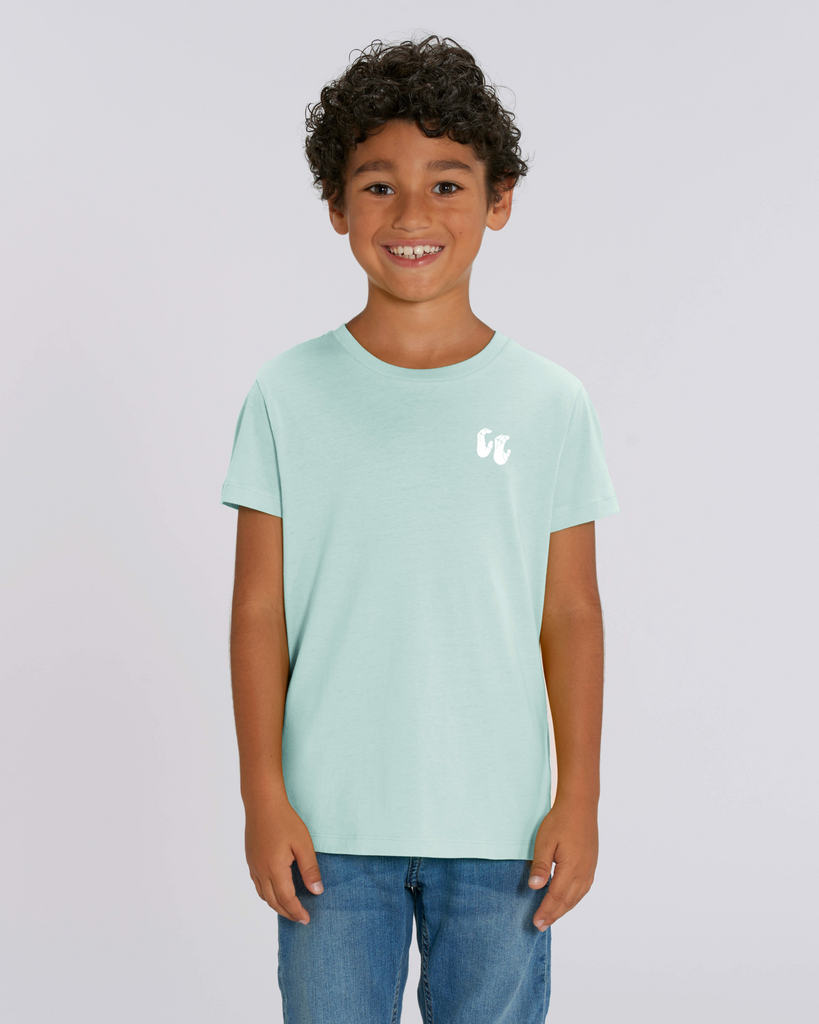 A boy wearing a kids organic cotton t-shirt in caribbean blue, with a printed white left chest logo