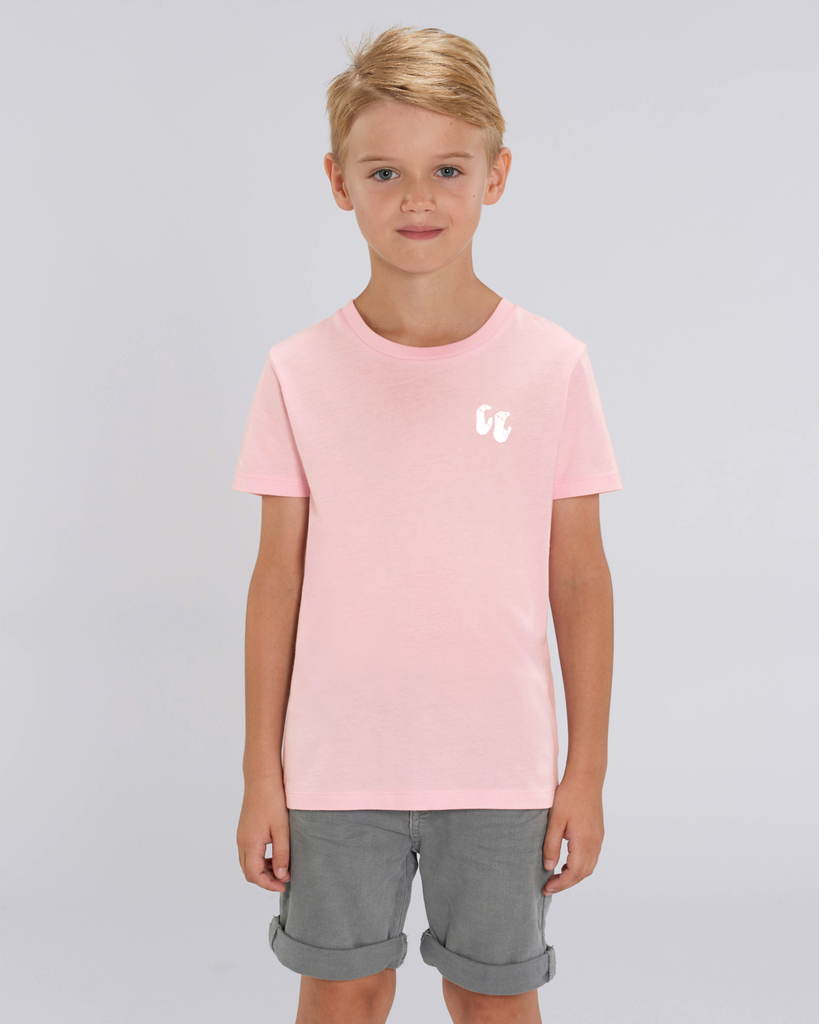 A boy wearing a kids organic cotton tshirt in cotton pink, with a printed white left chest logo
