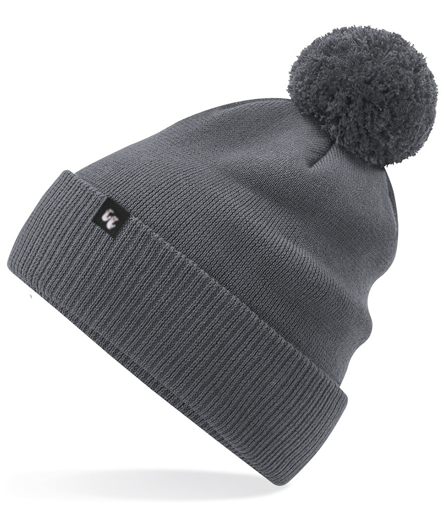 A graphite grey bobble hat beanie with pom pom made from organic cotton