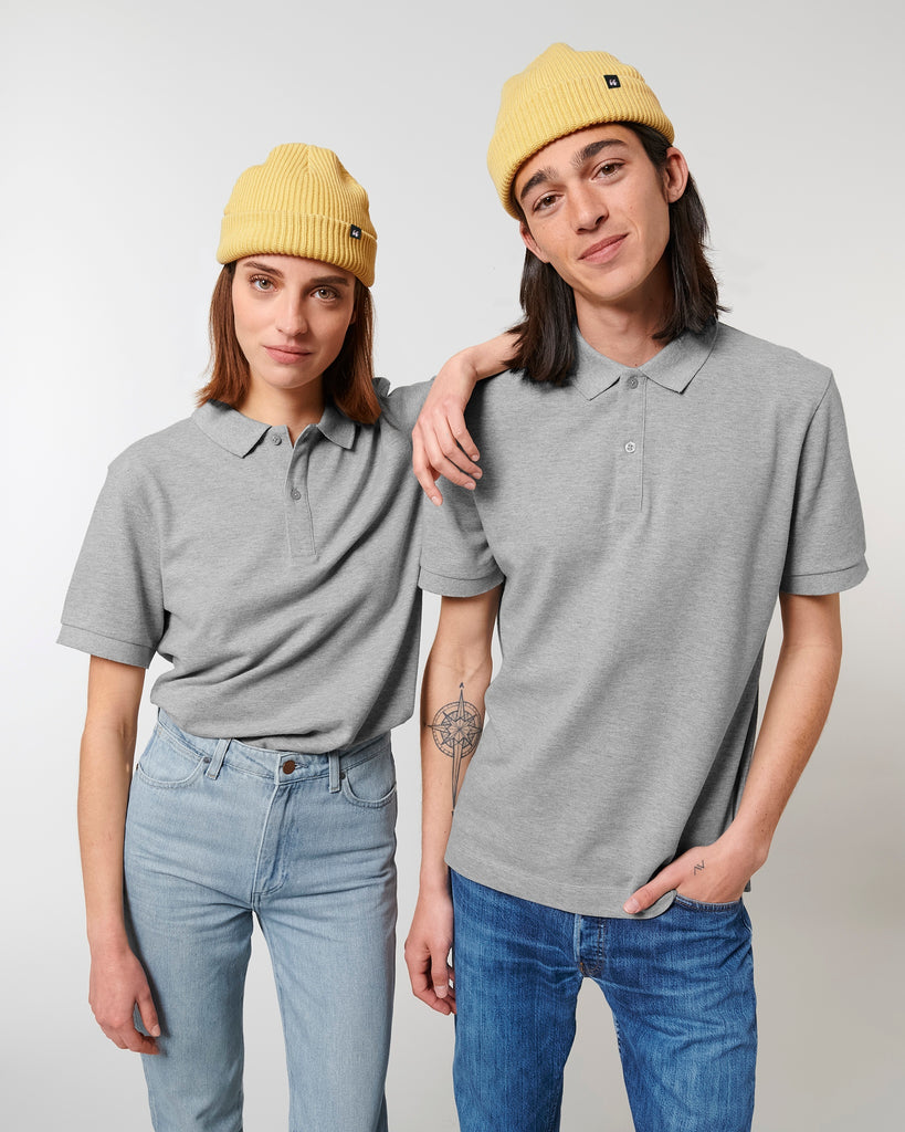 Two people wearing a pastel yellow unisex fisherman's beanie hats made from organic cotton