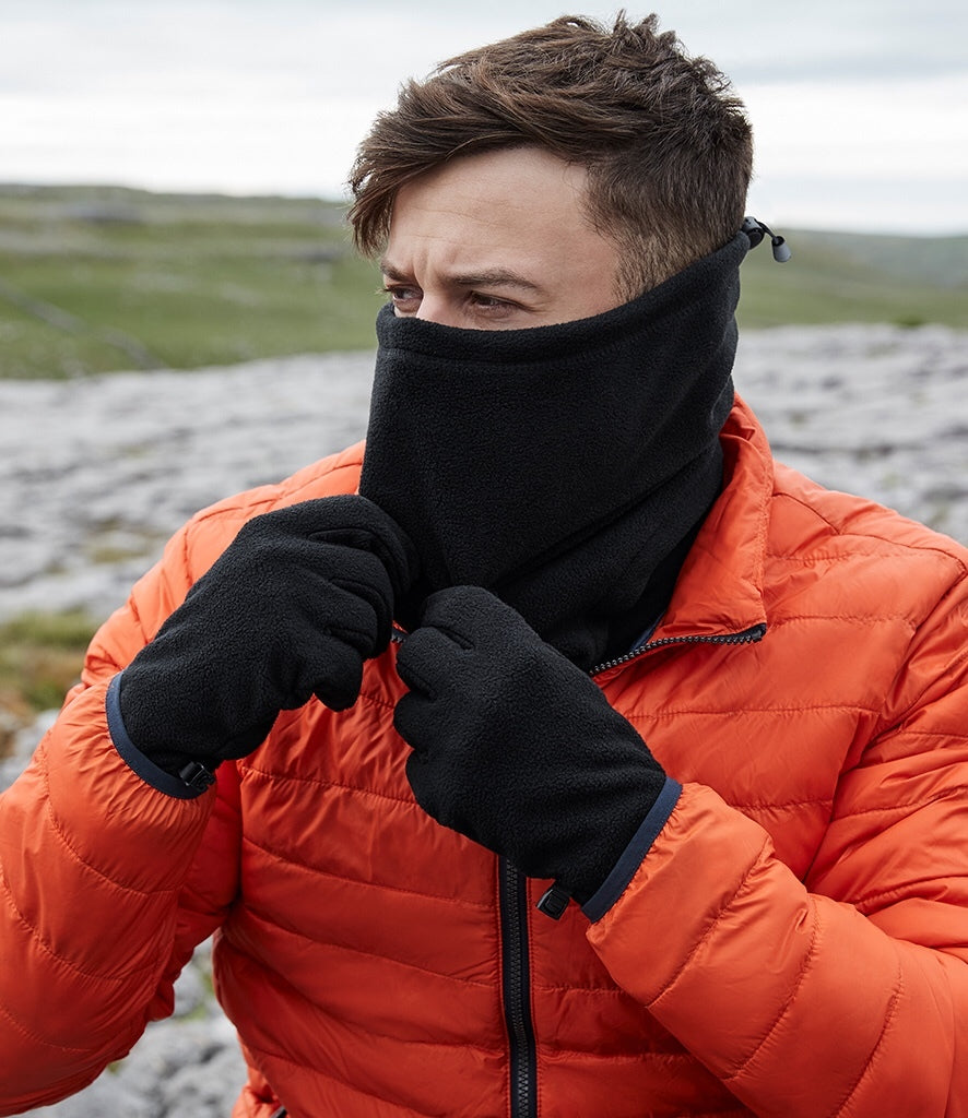 A man wearing a black recycled fleece snood neck warmer with orange jacket
