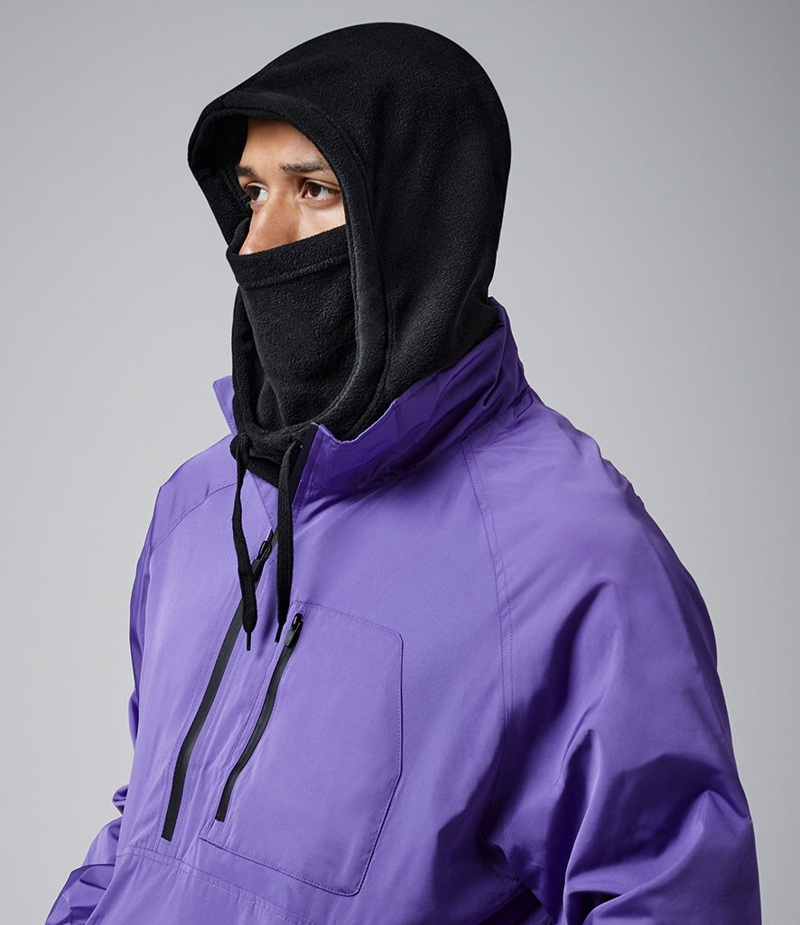 Man wearing a recycled fleece black hooded neck warmer with face covering