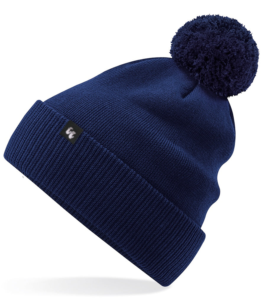 A navy blue bobble hat beanie with pom pom made from organic cotton