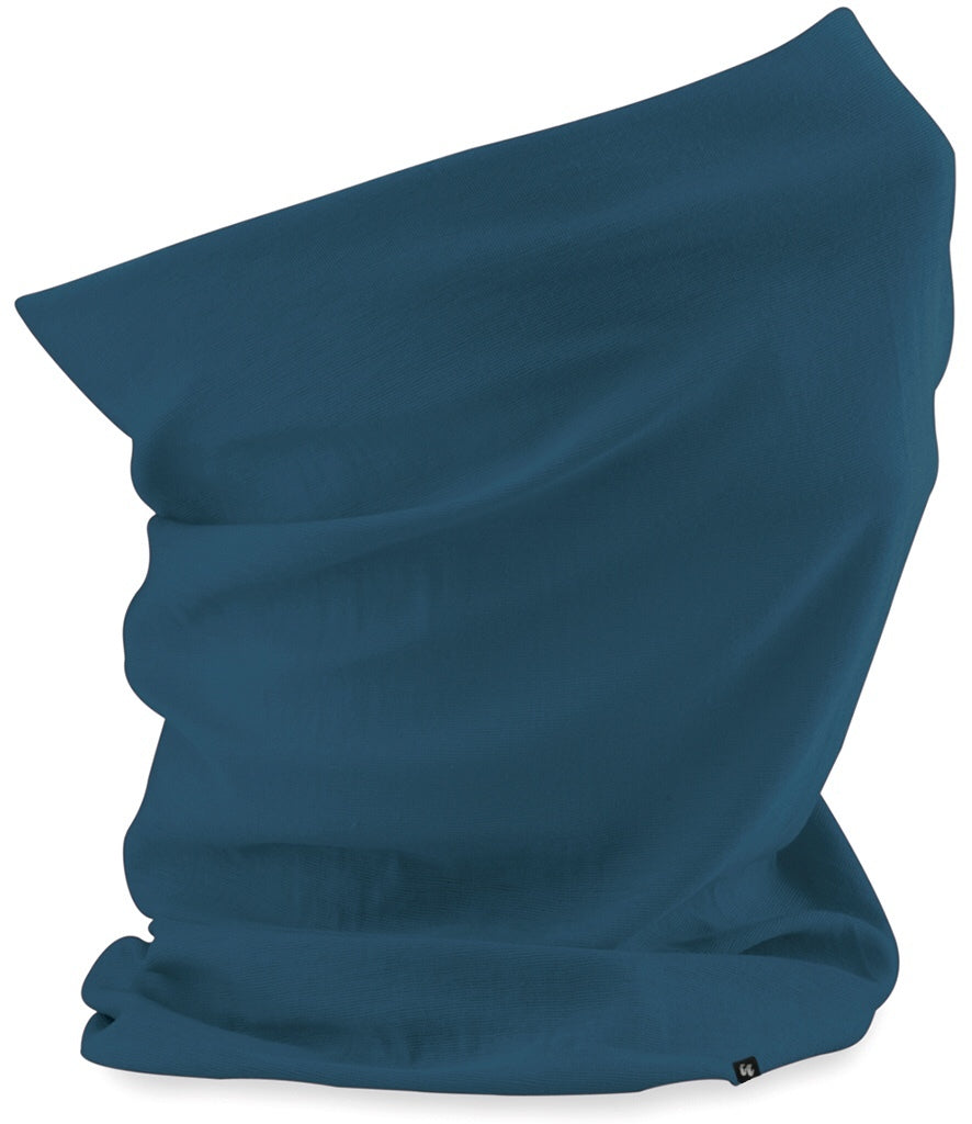 Side view of a petrol blue neck gaiter with small fabric tag stitched to the right hand side at the bottom