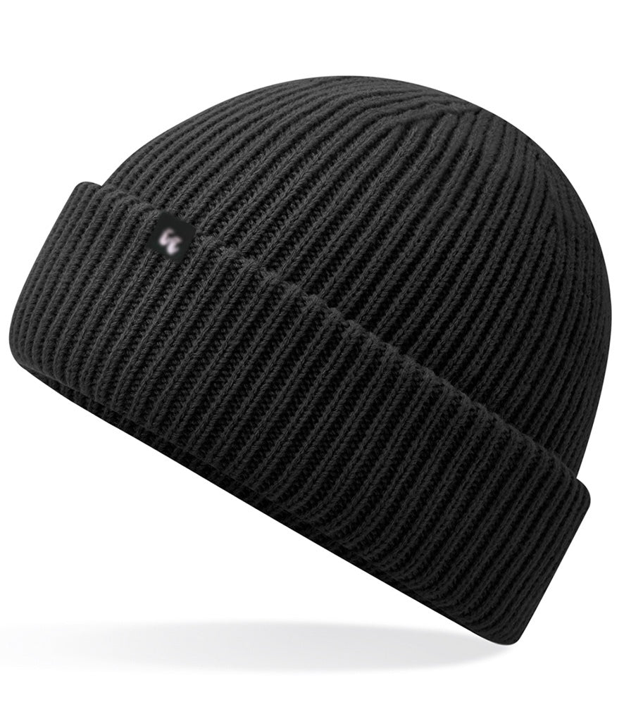 Recycled polyester beanie in black with a small black fabric tag on the front left-hand side. 