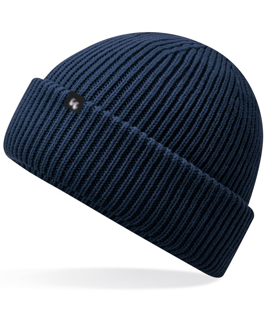 Recycled polyester beanie in french navy blue with a small black fabric tag on the front left-hand side. 