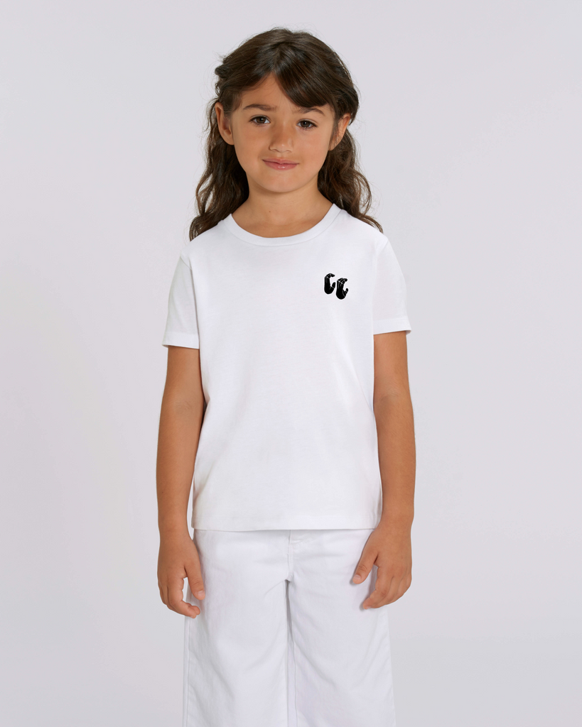 A girl wearing a kids organic cotton t-shirt in white, with a printed black left chest logo